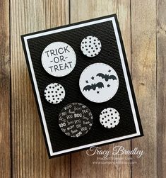 a black and white card with buttons that say trick or treat