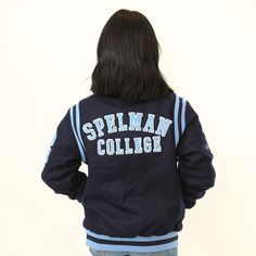 the back of a female college student's jacket that reads, spellman college