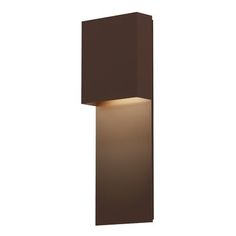 an outdoor wall light that is brown and has a white light on the side of it