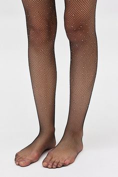 Essential tights from UO in a fishnet topped with tiny gems for a hint of shimmer. Find them only at Urban Outfitters. Features UO gem fishnet tights Fishnet tights with a little something extra Shimmery gem finish Stay-put waistband UO exclusive Content + Care 92% Nylon, 8% spandex Hand wash Imported Size + Fit S/M 4'10" -5'6" 90-130lbs L/XL 5'7" -5'6" 130-200lbs | Urban Outfitters UO Gem Fishnet Tights in Black, Women's at Urban Outfitters Fishnet Mesh Tights For Party, Party Fishnet Mesh Tights, Tight Fishnet Stockings For Party, Party Fishnet Legwear In Mesh, Party Fishnet Mesh Legwear, Glamorous Fishnet Bottoms For Night Out, Party Fishnet Stockings, Elegant Fishnet Stockings For Party, Party Fishnet Tights