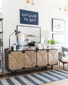 a living room with a large rug and wooden furniture in it's centerpiece