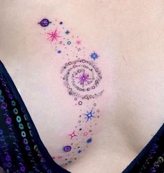 a woman's breast with stars and circles on it