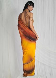 This is a gorgeous yellow to burnt orange to brown ombre sari. It has 3 beaded draped chains with a blouse made of honeycomb scalloped crystal embroidery. Ombre Saree, Ruffled Saree, Embellished Saree, Pure Georgette Sarees, Crystal Embroidery, Yellow Ombre, Hand Work Blouse, Yellow Saree, Sharara Set