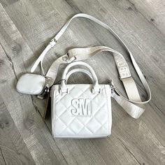 Steve Madden Bbabi Crossbody Bag/Purse Quilted In Chalk White. Brand New With Tag!! I Ship The Day Of Order If Possible! About This Item: Bottom Width 6.5” X Height 6.5” X Depth 2” Smooth Quilted Faux Leather Construction With Logo Hardware Accents Matching Accessory Pouch With Clip Dual Top Carry Handles And 2 Adjustable Removable Crossbody Straps Lined Interior With Zip Pocket Flat Bottom Steve Madden Purse Crossbody, Steve Madden Purse, White Crossbody Bag, Steve Madden Handbags, Best Purses, Black Crossbody Purse, Quilted Crossbody Bag, Steve Madden Bags, Chalk White