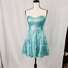 This Is A Brand New With Tags Bought From Dillards Dress. Newer Worn, Want To Be A Mermaid, This Is The Dress. It's Shines And Has Some Tull Underneath To Give It Some Structure. Perfect For Spring. It Is Also Hand Washable For Added Bonus. Blue Strapless Mini Dress For Party Season, Blue Sequined Strapless Dress, Blue Strapless Sequin Dress, Fitted Light Blue Strapless Dress For Party, Blue Fitted Strapless Dress For Homecoming, Blue Strapless Dress For Party Season, Fitted Blue Dress For Dress-up Occasions, Fitted Light Blue Dress For Dress-up, Blue Strapless Fitted Dress With Sequins