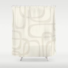 a white shower curtain with an abstract design on the front and back side, in neutral tones