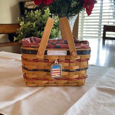 a basket with flowers in it sitting on a table