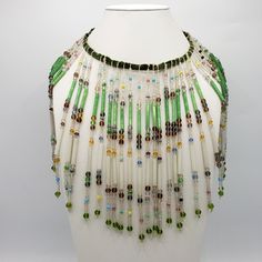 "If you're a flapper at heart and love the Roaring 20's, here's a necklace for you created from an Art Deco Beaded Lampshade. The neck is adjustable and the beaded dangles hang about 8\" long. In very good condition for a piece that is almost 100 years old. There is one strand missing and one long green bead that is cracked that no one will ever notice unless you point it out. Adjustable Neck; 8\" long dangles FREE SHIPPING IN USA. CONTACT ME FOR INTERNATIONAL SHIPPING OPTIONS Check out other Vi Bohemian Bead Caps Necklace For Party, Avatar Script, Avatar Design, Loom Necklace, Beaded Lampshade, Deco Beads, Flapper Necklace, Roaring 20's, Necklace Collar