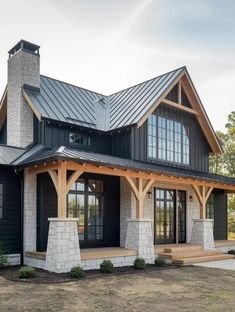 a black and white house with a metal roof