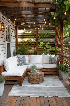 a white couch sitting on top of a wooden deck