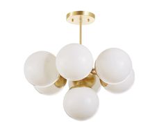 a chandelier with five white balls hanging from it's golden metal frame