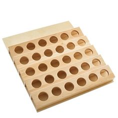 a wooden peg board with holes in the middle and two rows of holes on each side