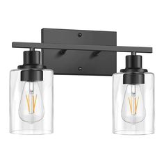 two light bathroom fixture with clear glass shades and black metal finish, on an off - white background