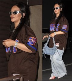 a woman in brown shirt and jeans carrying a handbag on her hippie side