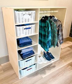 an organized closet with clothes and baskets