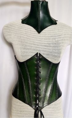 It is handmade leather under-bust corset with hand-sewn leather detailing. Fully adjustable at front with lace and back side with buckles. We used about 2 to 2.2 mm thick handmade leather. It is hand dyed handmade leather. It is crazy for medieval events and Larp.   Corset is hand made from sturdy top-grain leather.  Size is available from 30 to 46 inch, please check our size chart. It is handmade leather Neck Corset with hand-sewn by Embossed leather detailing. It's adjustable Lace in back side Steampunk Leather Corset Belt For Cosplay, Steampunk Leather Corset For Cosplay, Gothic Leather Corset For Cosplay, Gothic Leather Corset Belt For Larp, Medieval Leather Fitted Corset, Fitted Leather Medieval Corset, Medieval Style Fitted Leather Corset, Gothic Leather Overbust Corset, Fitted Leather Corset For Cosplay