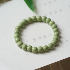 Material: Alloy Fashion Element: Beans Style: Ethnic Style Green Wooden Beads Jewelry, Green Wooden Bead Round Jewelry, Green Jewelry With Wooden Beads, Green Wooden Beaded Round Jewelry, Green Wooden Beads Bracelet, Green Wooden Beaded Bracelets As Gift, Green Bracelet With Wooden Beads, Casual Green Jewelry With Large Beads, Fake Lip Ring