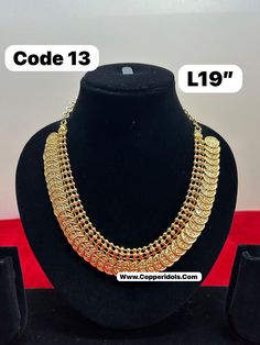 sizes in terms of height and weight are mentioned in grams and inches in the photo Gold Dual-tone Temple Necklace For Puja, Gold Dual-tone Jewelry For Puja, Heavy Gold Bollywood Necklaces, Heavy Gold Bollywood Necklace, Gold Heavy Bollywood Necklace, Dual-tone Gold Temple Necklace For Diwali, Gold Dual-tone Temple Necklace For Diwali, Bollywood Style Dual-tone Gold Temple Necklace, Festive Dual-tone Gold Temple Necklace