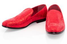 Steal glances in this smooth fitting, metallic styled loafer featuring an ornate embossed upper set atop a patent-black outsole, exuding a clean-cut, luxurious style for formal outfits. Formal Slip-on Loafers With Red Sole, Formal Slip-ons With Red Sole, Red Formal Dress Shoes For Spring, Red Spring Formal Dress Shoes, Formal Patent Leather Loafers With Textured Sole, Formal Patent Leather Loafers With Red Sole, Elegant Patent Leather Loafers With Red Sole, Formal Wingtip Slip-ons For Spring, Elegant Party Loafers With Red Sole