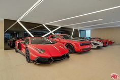 a bunch of cars that are sitting in a room