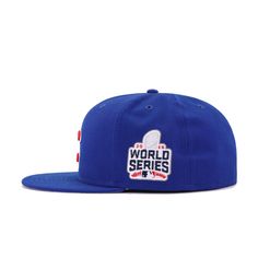 Celebrate the most riveting World Series wins in recent history with this special commemorative fitted from Hat Heaven. Draped in official team colors, this is undeniably a hat for Cubs fans. With left-sided patch from the historic Fall Classic, this is one custom fans have to have. Hat Material: 100% WoolCrown: Light Royal BlueVisor: Light Royal BlueButton: Light Royal BlueUndervisor: GreyFront Logo: Scarlet/WhiteRear Logo: Light Royal Blue/Scarlet/WhiteSide Patch: Official league colors Fitted Flat Crown Hat For Baseball Season, Flat Crown Fitted Hat For Baseball Season, Blue Baseball Cap With Logo Patch, Blue Fitted Hat For Baseball Season, Blue Flat Bill Fitted Hat With Logo Patch, Blue Fitted Hat With Logo Patch And Flat Bill, Collegiate Blue Baseball Cap With Flat Brim, Blue Baseball Cap With Logo Patch And Flat Brim, Blue Sports Fitted Hat With Logo Patch