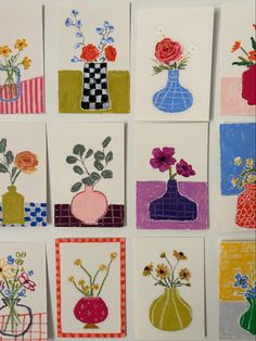 many different colored vases with flowers in them on a white background, all made out of paper