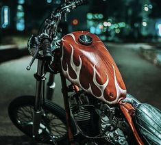 a red motorcycle with flames painted on it