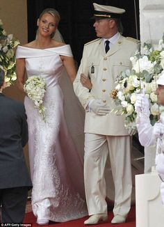 the bride and groom are walking down the aisle