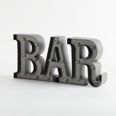 the word bar is made up of metal letters