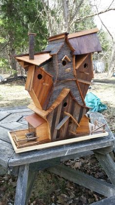 a bird house made out of wood and other things