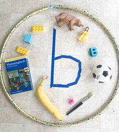 a table with legos and toys on it, including a banana, soccer ball