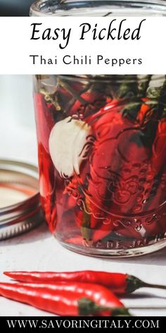 red peppers in a jar with text overlay that reads easy pickled thai chili peppers