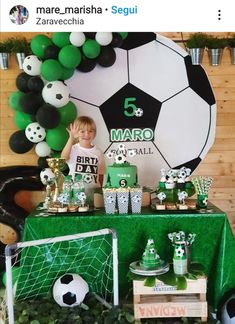 a soccer themed birthday party with green and black decorations