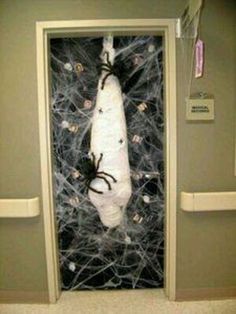 a spider wrapped in plastic sitting on top of a door