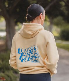 You'll look super smart while you're warming up for ballet, jazz, contemporary, tap, or hip hop class at the dance studio wearing this hoodie. Dancers of all styles will appreciate this inspirational quote from Albert Einstein. This on-trend vintage-style design is printed in bright blue on an ultra-soft pineapple yellow hooded sweatshirt. 80% ringspun cotton, 10% polyester, 10% recycled polyester Pineapple Yellow, Ballet Jazz, Albert Einstein Quotes, Yellow Hoodie, Warming Up, Youth Hoodies, Dance Studio, The Dance, Albert Einstein