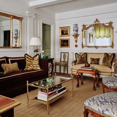 a living room filled with furniture and mirrors