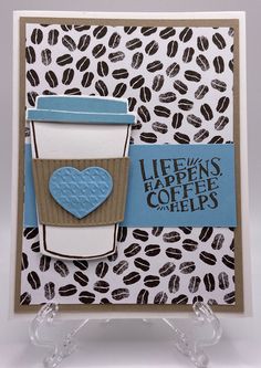 a card made with coffee beans and a heart on the front, it says life's happens coffee helps