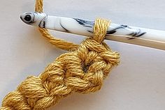 a crochet hook is attached to a rope