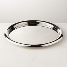 an oval metal tray on a white surface