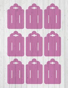 pink luggage tags on white wood planks