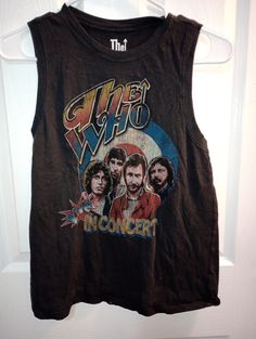 This is the Who t shirt in black or faded black. It has colorful graphics of the who. It is size small. Measurements are flat across shoulder 12 1/2", breast 20", hip 20", length lower shoulder down  vertical 23 1/2". Colorful Graphics, Muscle Shirt, Muscle Shirts, The Who, Black T Shirt, Black Tshirt, Gender Neutral, Bathing Beauties, Adult Outfits