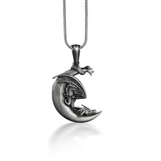 Dragon Sleeping in Crescent Necklace, Dragon and Moon Unusual Necklace in Silver, Fantasy Necklace For Best Friend, Celestial Necklace These 925K Sterling Silver Dragon with Moon Necklace has special handmade engraving details and photos are taken with original products. It's very elegant and classy for everyday use and gives stylish look to your outfits. Also, can be preferred as a gift for friends and family for an eternal memorial. Dream collection has many meanings behind its background; we Sterling Silver Moon Engraved Necklace, Sterling Silver Moon Shaped Engraved Necklace, Unique Moon-shaped Engraved Necklace, Unique Moon Shaped Engraved Necklace, Unique Engraved Moon-shaped Necklace, Sterling Silver Crescent Necklace With Charms, Silver Moon Necklace With Engraving, Silver Moon Jewelry With Adjustable Chain, Engraved Moon Silver Necklace