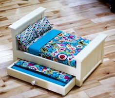 a child's bed that has been made into a couch with drawers underneath it