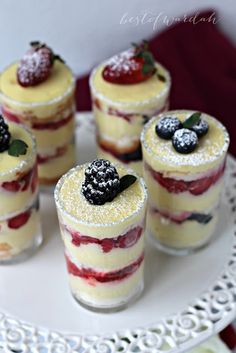 small desserts are arranged on a white plate