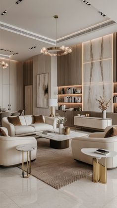 an elegant living room with white furniture and gold accents on the walls, along with marble flooring