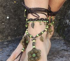 This listing is for one anklet. Beautiful macrame anklet. You can wear it alone or in combination with the barefoot sandals available in my shop (picture 2 and 4) https://www.etsy.com/listing/589470076/big-brass-flower-barefoot-sandals-green?ref=shop_home_active_2 This anklet is made with waxed polyester cord, antique bronze beads and charms and toho seed beads. They close with a lobster claw and on the other side a small chain allows to adjust the length of the anklet. The anklet comes in a bea Hippie Summer Festival Jewelry, Bohemian Anklets For Festivals, Adjustable Toe-ring Anklets For Festivals, Bohemian Style Toe Ring For Festivals, Bohemian Toe Ring For Festivals, Bohemian Festival Toe Ring Jewelry, Bohemian Style Festival Toe Ring, Green Bohemian Bracelets For Festivals, Adjustable Bohemian Jewelry For Music Festivals