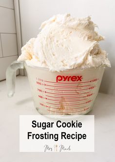 a frosted cake in a measuring cup with the words, sugar cookie frosting recipe