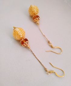 Beaded bead ball earrings  mosaic earrings. Long chandelier earrings. Ball motif. 24 k gold filling. Folklore romantic jewelry. Long chandelier earrings ,flower motif,24 karat gold filling. Long bright flower earrings will be a great addition to your ethnic style outfit. Or they will be the perfect gift for a loved one. Earrings length 7.5 cm (2.9in) Width 1.4 cm( 0.55 in) The earrings are very light. Only high quality materials (Japanese Miyuki beads, crystal beads, 24K gold filling ) Earrings Elegant Yellow Beaded Earrings, Gold Drop Earrings With Gold Beads, Handmade Gold Beaded Drop Earrings, Gold Plated Earrings With Gold Beads As A Gift, Gold Beaded Dangling Earrings As Gift, Traditional Gold Earrings With Faceted Beads, Gold Beaded Earrings With Dangling Beads As Gift, Elegant Gold Plated Round Bead Earrings, Gold Beaded Earrings With Faceted Round Beads