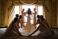 a bride and her bridesmaids getting ready for their wedding at the grand america hotel