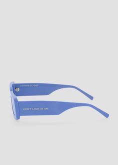 Sleek, full acetate rectangular frame. "DON'T LOOK AT ME" detailing on the left temple. Blue frames with blue lenses. Modern Blue Rectangular Sunglasses, Modern Blue Acetate Sunglasses, Modern Blue Square Frame Sunglasses, Blue Frames, Blue Lenses, Show And Tell, Look At Me, Temple, Lenses